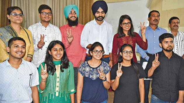 (Second from left, back row) Newly elected PUCSC joint secretary Vipul Atray, secretary Amarinder Singh, vice-president Daler Singh and president Kanupriya; and (from left, front row) elected executive members Vaibhav Mahajan, Varinda, Vinny Kaur, Ramanpreet Kaur and Anand Kumar during the oath-taking ceremony at Panjab University on Friday. (HT Photo) (Second from left, back row) Newly elected PUCSC joint secretary Vipul Atray, secretary Amarinder Singh, vice-president Daler Singh and president Kanupriya; and (from left, front row) elected executive members Vaibhav Mahajan, Varinda, Vinny Kaur, Ramanpreet Kaur and Anand Kumar during the oath-taking ceremony at Panjab University on Friday. (HT Photo)