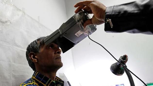 A man goes through the process of eye scanning for the Unique Identification (UID) database system, also known as Aadhaar, at a registration centre in New Delhi, India, January 17, 2018. Picture taken January 17, 2018. REUTERS/Saumya Khandelwal(Reuters File Photo) A man goes through the process of eye scanning for the Unique Identification (UID) database system, also known as Aadhaar, at a registration centre in New Delhi, India, January 17, 2018. Picture taken January 17, 2018. REUTERS/Saumya Khandelwal(Reuters File Photo)