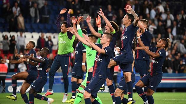 Paris Saint-Germain's players celebrate after winning the French L1 football match against Saint-Etienne (ASSE) at the Parc des Princes stadium in Paris.(AFP)