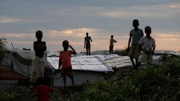 Internally displaced people (IDPs) stand on roofs in the Protection of Civilians (POC) Camp, run by the UN Mission in South Sudan near Malakal. South Sudan’s President Salva Kiir and rebel groups may well have signed a peace agreement on Wednesday to end a civil war that has killed at least 50,000, but those who have fled the country’s second largest city, a merchant hub turned ghost town, remain fearful of going back. (Baz Ratner / REUTERS) Internally displaced people (IDPs) stand on roofs in the Protection of Civilians (POC) Camp, run by the UN Mission in South Sudan near Malakal. South Sudan’s President Salva Kiir and rebel groups may well have signed a peace agreement on Wednesday to end a civil war that has killed at least 50,000, but those who have fled the country’s second largest city, a merchant hub turned ghost town, remain fearful of going back. (Baz Ratner / REUTERS)