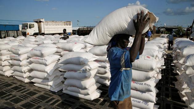 A man carries sacks of food aid for distribution to IDPs in the POC Camp. Josephine Adiemis, who lives with her family of eight in the camp, does not believe it is safe yet to go back home. Squatters may have sneaked into her house amid the chaos, the 42-year-old said. (Baz Ratner / REUTERS) A man carries sacks of food aid for distribution to IDPs in the POC Camp. Josephine Adiemis, who lives with her family of eight in the camp, does not believe it is safe yet to go back home. Squatters may have sneaked into her house amid the chaos, the 42-year-old said. (Baz Ratner / REUTERS)