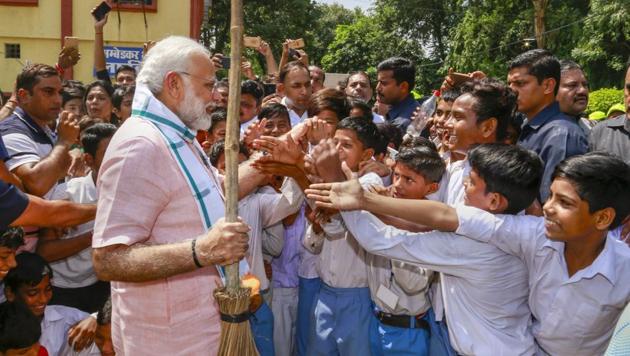 Prime Minister Narendra Modi greets schoolchildren as he undertakes a cleanliness drive under 'Swachhta Hi Sewa' campaign in the premises of Baba Sahib Ambedkar Higher Secondary School at Paharganj, in New Delhi, Saturday, Sept 15, 2018. (PTI) Prime Minister Narendra Modi greets schoolchildren as he undertakes a cleanliness drive under 'Swachhta Hi Sewa' campaign in the premises of Baba Sahib Ambedkar Higher Secondary School at Paharganj, in New Delhi, Saturday, Sept 15, 2018. (PTI)