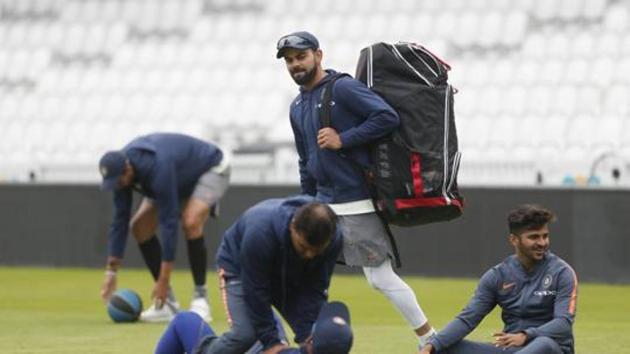 India's Virat Kohli, carries his batting equipment as he takes part in a nets session (AP) India's Virat Kohli, carries his batting equipment as he takes part in a nets session (AP)