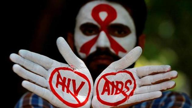 A student displays his hands painted with messages as he poses during an HIV/AIDS awareness campaign.(REUTERS File Photo)