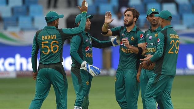 Pakistan cricketer Usman Khan (C) celebrates with teammates after he dismissed Hong Kong batsmans Scott McKechnie during the one day international (ODI) Asia Cup cricket match between Hong Kong and Pakistan at the Dubai International Cricket Stadium in Dubai on September 16, 2018. (AFP) Pakistan cricketer Usman Khan (C) celebrates with teammates after he dismissed Hong Kong batsmans Scott McKechnie during the one day international (ODI) Asia Cup cricket match between Hong Kong and Pakistan at the Dubai International Cricket Stadium in Dubai on September 16, 2018. (AFP)