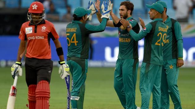 Pakistan cricketer Usman Khan (C) celebrates with teammates after he dismissed Hong Kong batsmans Tanwir Afzal during the one day international (ODI) Asia Cup cricket match between Hong Kong and Pakistan at the Dubai International Cricket Stadium in Dubai on September 16, 2018. (AFP)