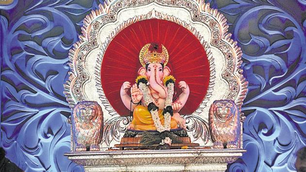 The Kasba Ganpati, the first to be installed in the city, was led in a procession on Laxmi road on Thursday.  (HT PHOTO) 