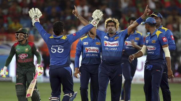 Sri Lanka's Lasith Malinga, center facing camera, celebrates with teammates the dismissal of Bangladesh's Rubel Hossain. (AP) Sri Lanka's Lasith Malinga, center facing camera, celebrates with teammates the dismissal of Bangladesh's Rubel Hossain. (AP)