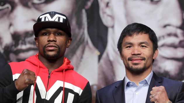 Floyd Mayweather Jr. (L) and WBO welterweight champion Manny Pacquiao pose during a news conference.(AFP)
