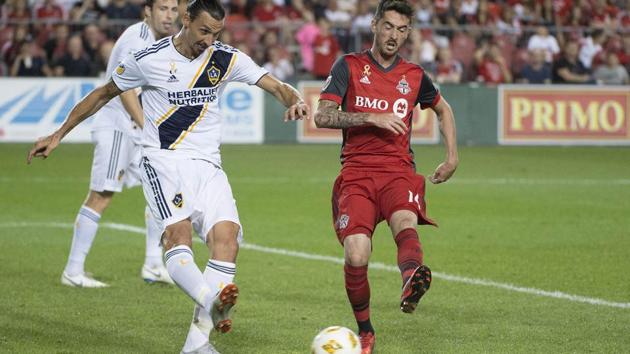 Zlatan Ibrahimovic (left) battles for the ball with Toronto FC midfielder Jay Chapman.(USA TODAY Sports)