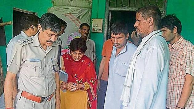 Police and forensic experts collecting evidence from the house of the deceased girl at Behbal village in Rohtak district on Sunday. (HT Photo) Police and forensic experts collecting evidence from the house of the deceased girl at Behbal village in Rohtak district on Sunday. (HT Photo)