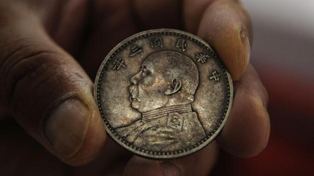 A coin dating back to late 19th or early 20th century is seen at Munshi Aziz Bhat Museum. “We definitely need funds for maintenance, better display of artefacts, museum building, art shop but the state government has not listened to our pleas though we have offered to give land for a new museum,” said Ajaz Munshi. The lack of footfall is another challenge. (Waseem Andrabi / HT Photo) 