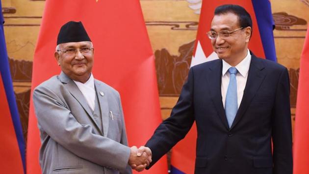 Nepal's Prime Minister K.P. Sharma Oli (L) shakes hands with Chinese Premier Li Keqiang during a signing ceremony at the Great Hall of the People in Beijing on June 21, 2018.(AFP file)