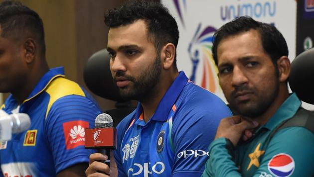 Indian cricket team captain Rohit Sharma (C) speaks during an Asia Cup press conference.(AFP)