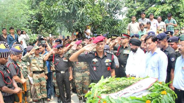 Soldiers, officials and local pay tribute to Lance Naik Mohan Nath Goswami at Bindukhatta village on Saturday. (HT Photo) Soldiers, officials and local pay tribute to Lance Naik Mohan Nath Goswami at Bindukhatta village on Saturday. (HT Photo)