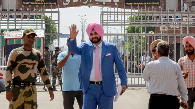 Punjab minister and former cricketer Navjot Singh Sidhu waves as he crosses the border to attend the swearing-in ceremony of Pakistan Prime Minister-elect Imran Khan, at Attari-Wagah border in Attari.(PTI File Photo)
