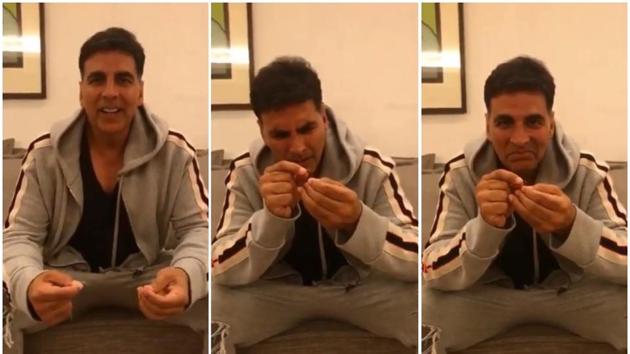 Akshay Kumar tries his hand at thread the needle challenge, accepts defeat.(Twitter)