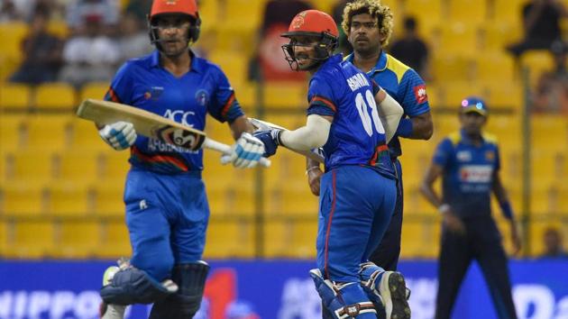 Afghan batsmen Hashmatullah Shahidi (L) and Rahmat Shah (2L) run between the wickets as Sri Lankan cricketer Lasith Malinga looks on. (AFP) Afghan batsmen Hashmatullah Shahidi (L) and Rahmat Shah (2L) run between the wickets as Sri Lankan cricketer Lasith Malinga looks on. (AFP)