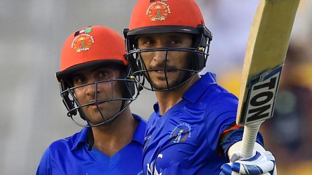 Afghan batsman batsman Rahmat Shah (R) celebrates after scoring a half-century (50 runs) as Hashmatullah Shahidi looks on. (AFP) Afghan batsman batsman Rahmat Shah (R) celebrates after scoring a half-century (50 runs) as Hashmatullah Shahidi looks on. (AFP)
