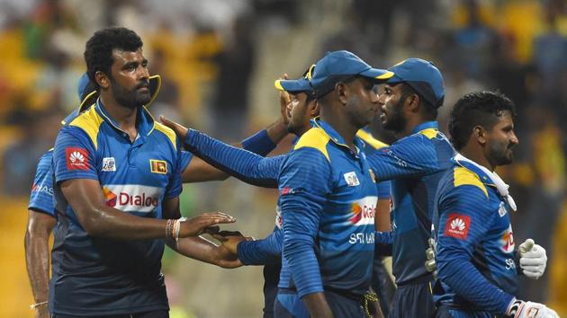 Sri Lankan cricketer Thisara Perera (L) celebrates with teammates after he dismissed Afghan batsman Mujeeb Ur Rahman. (AFP) Sri Lankan cricketer Thisara Perera (L) celebrates with teammates after he dismissed Afghan batsman Mujeeb Ur Rahman. (AFP)