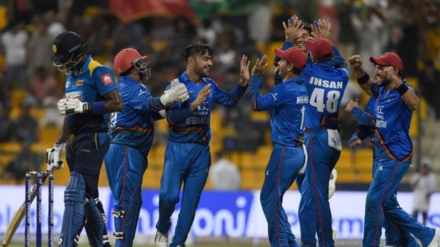 Afghanistan players celebrate the fall of a Sri Lanka wicket in Abu Dhabi on Monday. (AFP) Afghanistan players celebrate the fall of a Sri Lanka wicket in Abu Dhabi on Monday. (AFP)