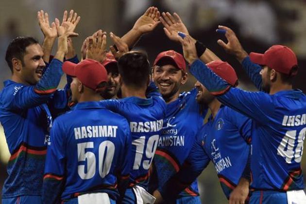 Mohammad Nabi (L) celebrates with teammates.(AFP)