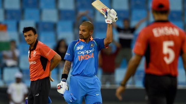 Indian batsman Shikhar Dhawan (C) celebrates after scoring a century. (AFP)