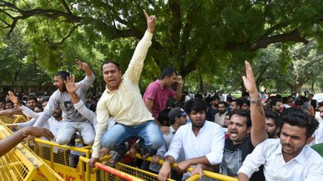 Candidates protest during the counting of votes for Delhi University Students Union (DUSU) election, at counting centre, New Police Line, in New Delhi, India.(HT Representative Photo)