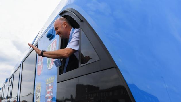 An employee of French train maker Alstom, waves from a window upon the arrival of Alstom's first hydrogen-powered train at the train station in Bremervoerde, Germany as it enters service on September 16, 2018. (AFP) An employee of French train maker Alstom, waves from a window upon the arrival of Alstom's first hydrogen-powered train at the train station in Bremervoerde, Germany as it enters service on September 16, 2018. (AFP)