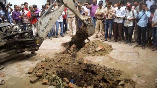 Police investigate the site where a rape victim was allegedly buried, at a government shelter home in Muzaffarpur, on July 23. (PTI File Photo) Police investigate the site where a rape victim was allegedly buried, at a government shelter home in Muzaffarpur, on July 23. (PTI File Photo)