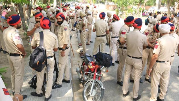 Police force deployed at Government Polytechnic College in Bathinda  ahead of the polls. A total of 17,268 polling booths will be set up and 86,340 personnel will be put on the election duty. Thirty-five observers will be appointed to ensure peaceful conduct of the polls, State election commissioner Sandhu told PTI.  (Sanjeev Kumar/HT) 