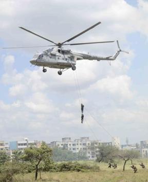 A demonstration of slithering by troops of various nations at the Aundh Military Station in Pune during Milex 2018. (Ravindra Joshi/HT PHOTO) 