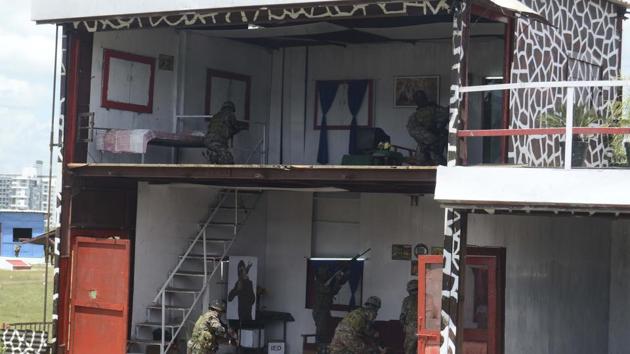 A demonstration of a cordon and search operation by the troops of the Bhutan army during Milex 2018 in Pune. (Ravindra Joshi/HT PHOTO) 