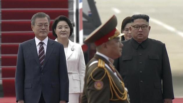 In this image made from video provided by Korea Broadcasting System (KBS), South Korean President Moon Jae-in, left, and his wife Kim Jung-sook, second from left, walk with North Korean leader Kim Jong Un and his wife Ri Sol Ju upon their arrival in Pyongyang, North Korea on September 18.(AP Photo) In this image made from video provided by Korea Broadcasting System (KBS), South Korean President Moon Jae-in, left, and his wife Kim Jung-sook, second from left, walk with North Korean leader Kim Jong Un and his wife Ri Sol Ju upon their arrival in Pyongyang, North Korea on September 18.(AP Photo)