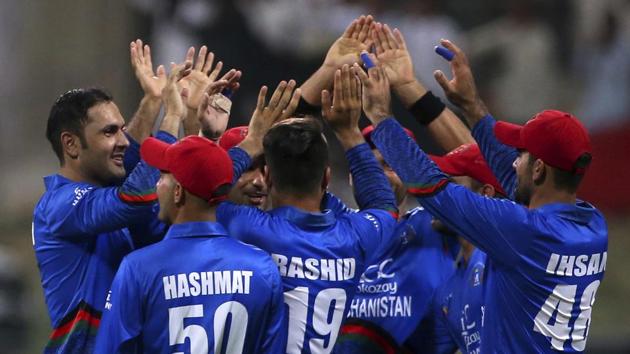 Afghanistan's Mohammad Nabi, left, celebrates with teammates the dismissal of Sri Lanka's captain Angelo Mathews.(AP)