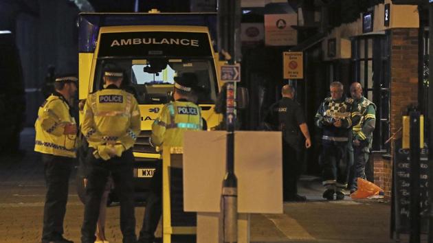 Emergency services personnel stage outside Prezzo restaurant on September 16 in Salisbury, United Kingdom, where police have closed streets as a "precautionary measure" after two people were taken ill from the restaurant, amid heightened tensions after the Novichok poisonings earlier in the year.(AP Photo)