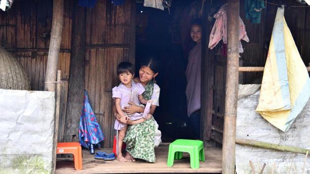 Pyndaplin Shabong, 31, with her daughter at her house in the village. “The composition of the melody comes from the bottom of my heart,” said, the mother-of-three. “It expresses my joy and love for my baby,” the 31-year-old added. (Biju Boro / AFP) Pyndaplin Shabong, 31, with her daughter at her house in the village. “The composition of the melody comes from the bottom of my heart,” said, the mother-of-three. “It expresses my joy and love for my baby,” the 31-year-old added. (Biju Boro / AFP)