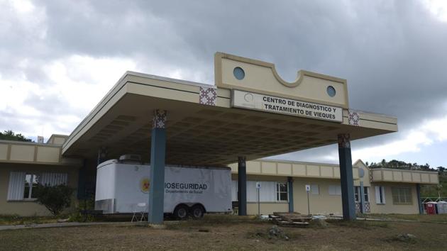 The Vieques dialysis centre was located in the island’s only medical clinic. The building still stands, though it is heavily damaged and strewn with horse manure. Weeks after Hurricane Maria hit in 2017, health officials declared it contaminated and ordered it be demolished. Although flights to the mainland take just 20 minutes, the journey is far longer. (Carlos Giusti / AP) 