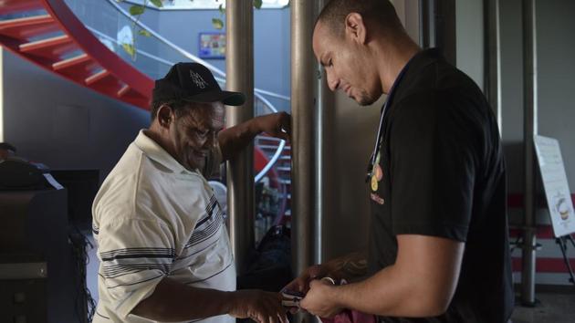 A nurse checks the blood oxygen saturation levels of dialysis patient Edwin Alvarado. Survivors of those who have died over the past year acknowledge that their loved ones were very sick, but they believe they need not have perished. Argeo Caraballo, 70, died of heart failure on February 13. “The trips were way too exhausting,” his daughter Gladys said. (Carlos Giusti / AP) 