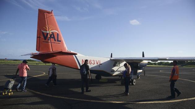 Patients prepare to board a plane at the airport in Vieques, that will take them to Ceiba Puerto Rico. Deputy Mayor Daisy Cruz said she is in constant communication with FEMA officials but receives limited answers. She said she has proposed rehabilitating an old pharmacy so it can be used for dialysis, but has not heard back from the company that ran the clinic. (Carlos Giusti / AP) 