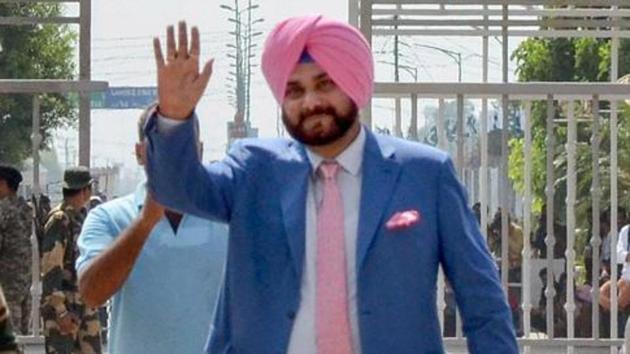 Punjab cabinet minister and former cricketer Navjot Singh Sidhu waves as he crosses the border to attend the swearing-in ceremony of Pakistan Prime Minister-elect Imran Khan, at Attari-Wagah border in Attari on August 17, 2018. (PTI) Punjab cabinet minister and former cricketer Navjot Singh Sidhu waves as he crosses the border to attend the swearing-in ceremony of Pakistan Prime Minister-elect Imran Khan, at Attari-Wagah border in Attari on August 17, 2018. (PTI)