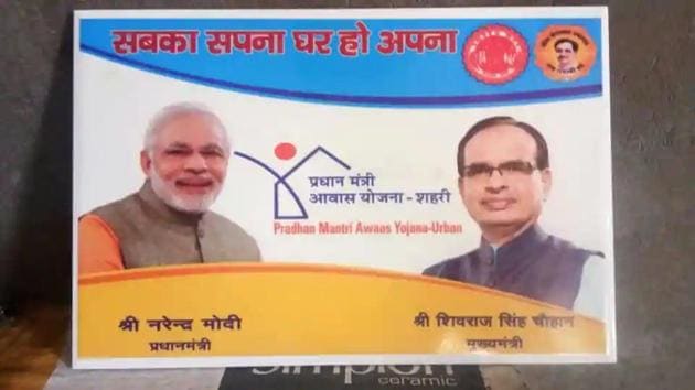 A tile bearing photographs of Prime Minister Narendra Modi and chief minister Madhya Pradesh Shivraj Singh Chouhan to be used in Pradhan Mantri Awas Yojna (PMAY) (Urban) . (HT FIle Photo) A tile bearing photographs of Prime Minister Narendra Modi and chief minister Madhya Pradesh Shivraj Singh Chouhan to be used in Pradhan Mantri Awas Yojna (PMAY) (Urban) . (HT FIle Photo)