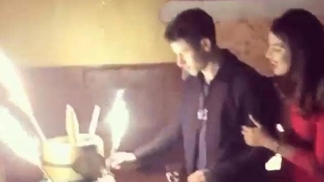 Nick Jonas cuts his birthday cake with Priyanka Chopra by his side.(Instagram)