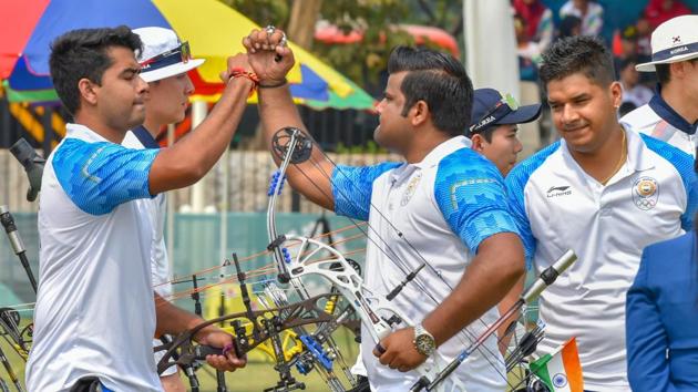 Indian archers Rajat Chauhan, Aman Saini and Abhishek Verma celebrate after winning the Silver medal in men's compound team event, at the Asian Games 2018 in Jakarta.(PTI)