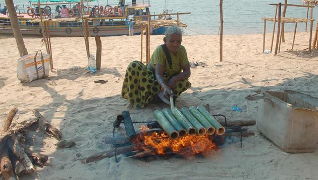 Bamboo chicken is prepared by stuffing chicken in a fresh bamboo shoot and slow-cooking it over charcoal. (M Krishna/HT Photo) Bamboo chicken is prepared by stuffing chicken in a fresh bamboo shoot and slow-cooking it over charcoal. (M Krishna/HT Photo)