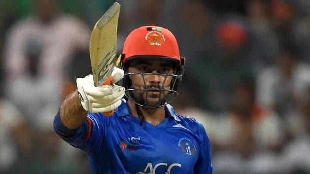 Rashid Khan celebrates after scoring a half-century during the Asia Cup 2018 match between Bangladesh and Afghanistan.(AFP)