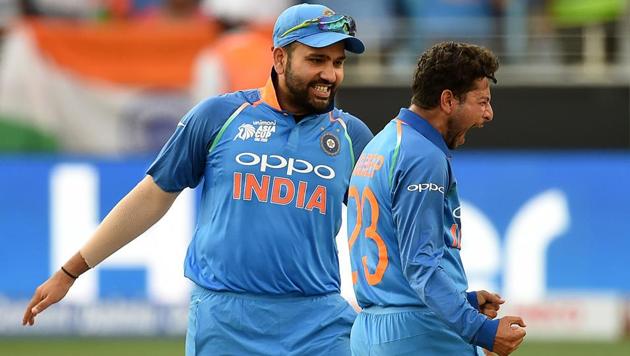 India skipper Rohit Sharma (left) and Kuldeep Yadav celebrate the fall of a Pakistan wicket in Dubai on Wednesday. (AFP) India skipper Rohit Sharma (left) and Kuldeep Yadav celebrate the fall of a Pakistan wicket in Dubai on Wednesday. (AFP)