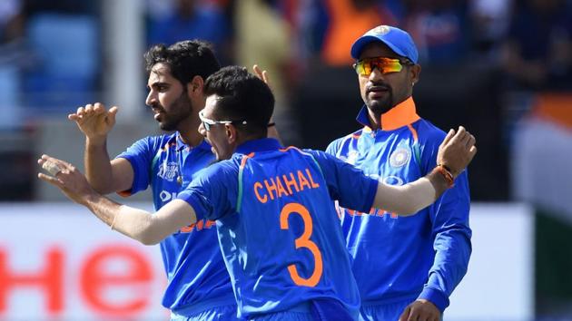 Indian players celebrate the fall of a Pakistan wicket in Dubai on Wednesday. (AFP) Indian players celebrate the fall of a Pakistan wicket in Dubai on Wednesday. (AFP)