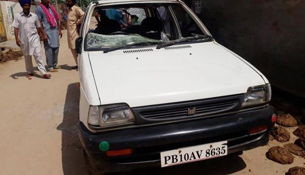 A car damaged in violence at Dullewala village in Bathinda on Wednesday.(Sanjeev Kumar/HT)