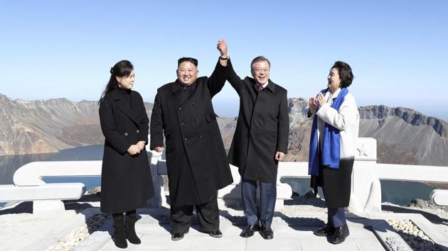 South Korean President Moon Jae-in (2nd-R), and his wife Kim Jung-sook (R), stand with North Korean leader Kim Jong Un (2nd-L), and his wife Ri Sol Ju on Mount Paektu in North Korea. There is no more sacred place in North Korea than Mount Paektu —and getting the South Korean President to such a spot is a propaganda coup unlike any other. (Pyongyang Press Corps Pool via AP) South Korean President Moon Jae-in (2nd-R), and his wife Kim Jung-sook (R), stand with North Korean leader Kim Jong Un (2nd-L), and his wife Ri Sol Ju on Mount Paektu in North Korea. There is no more sacred place in North Korea than Mount Paektu —and getting the South Korean President to such a spot is a propaganda coup unlike any other. (Pyongyang Press Corps Pool via AP)